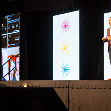 Event-Photography This image features a large, engaged audience attending a speaker presentation at the San Diego Convention Center, highlighting Coldea Productions' expertise in event photography to capture impactful moments.