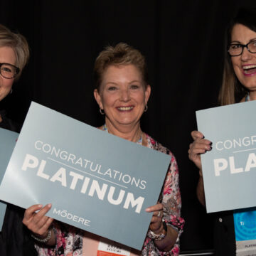 Convention-Photography Coldea Productions captures a behind-the-scenes moment as a makeup artist applies makeup to a woman before an event at Santa Clara Convention Center. This image highlights the detailed preparation involved in event coverage.