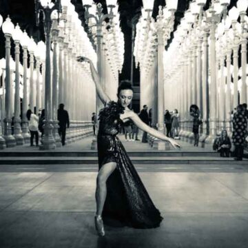 Dancer in an elegant gown poses gracefully at the "Urban Light" installation at LACMA, captured by Coldea Productions.