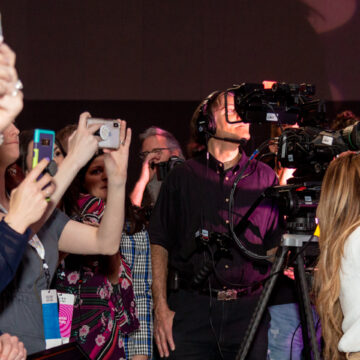 Convention-Photography Attendees capturing moments at a conference with a videographer from Coldea Productions filming the event at Moscone Center.
