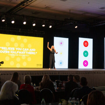 Convention-Photography Motivational speaker on stage delivering an inspiring message, captured by Coldea Productions at the Los Angeles Convention Center