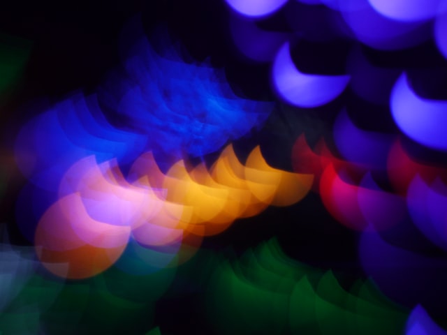 Abstract bokeh light effect with vibrant colors, creating a soft, out-of-focus visual.