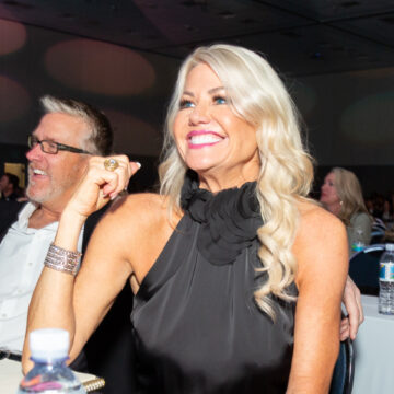 Conference-Photography Scentsy team members enjoying a presentation at the Envision 20/20 conference, captured by Coldea Productions, highlighting corporate event engagement.