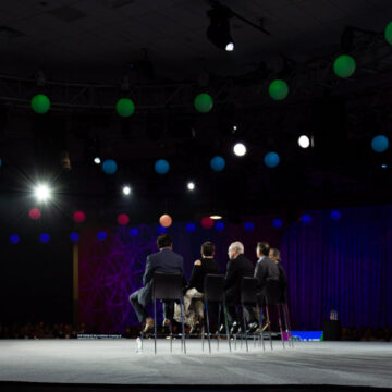 Event-Photography This image captures the audience's standing ovation at the Pasadena Convention Center, with Coldea Productions showcasing their skill in event photography by capturing the crowd's engagement and appreciation.