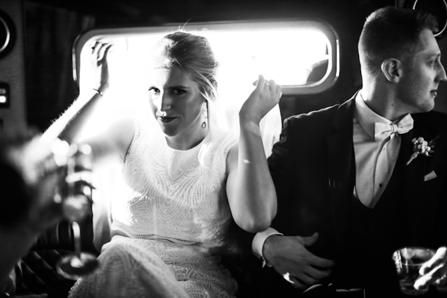 bride-and-groom-woman-in-white-tank-top-sitting-on-car-seat-coldeaproductions