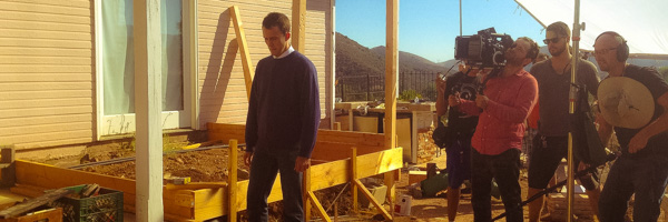 Director of Photography Cristian Coldea filming with a crew for a video commercial.