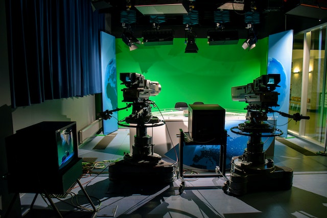 Professional film studio with a green screen.