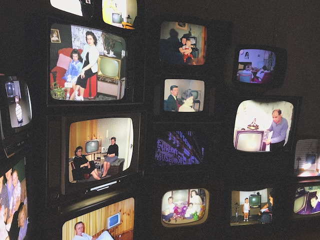 Multiple old televisions displaying family scenes from the past in a collage format.