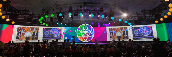 A vibrant event at the Anaheim Convention Center photographed by Coldea Productions for the Astellas Pharma Inc. convention, featuring a colorful stage setup and audience engagement.