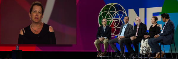 Panel of experts and a featured speaker displayed on a large screen during a conference in Long Beach, captured by Coldea Productions event photography near Los Angeles in Long Beach.