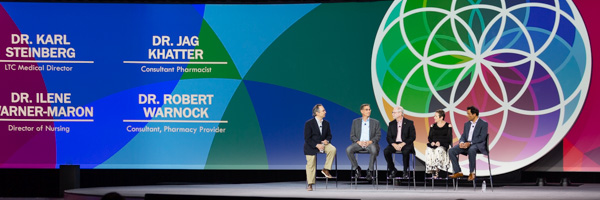 Corporate panel discussion with distinguished professionals, captured by Coldea Productions event photography services, featuring vibrant stage visuals