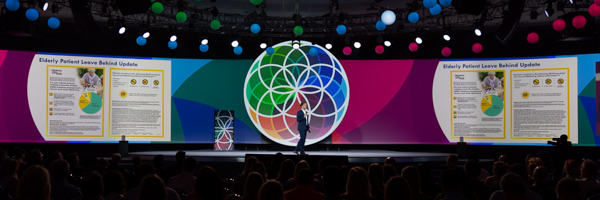 Corporate presentation on a vibrant stage with audience engagement, captured by Coldea Productions event photography services in Long Beach near Los Angeles