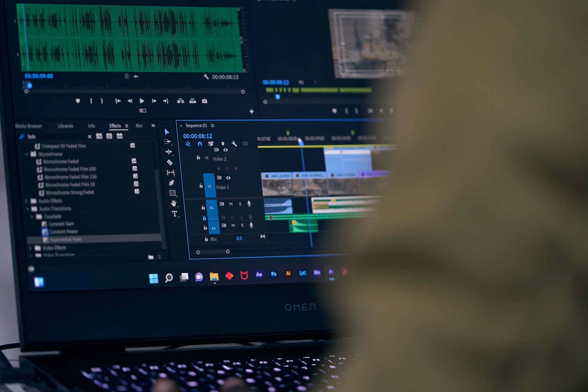 A person doing sound editing and mixing