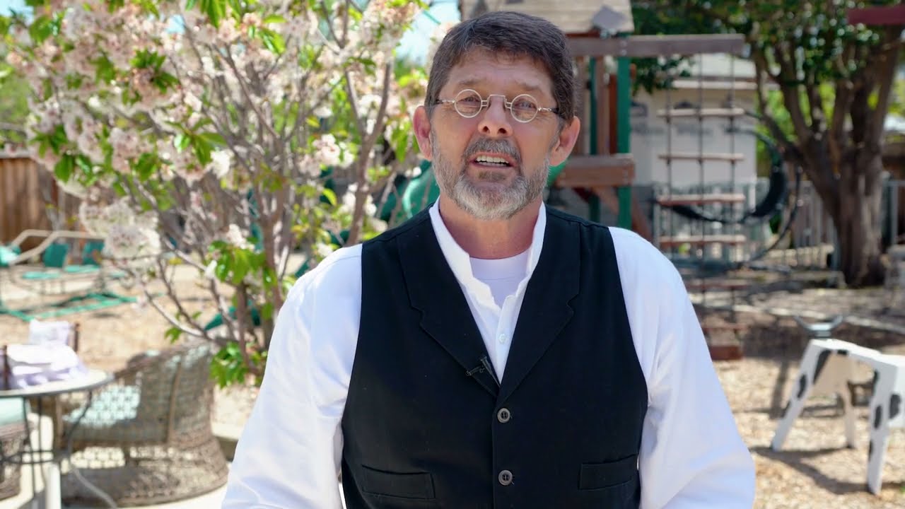 A man giving a testimonial in an outdoor setting, part of a dentist testimonial video presentation captured by Coldea Productions.