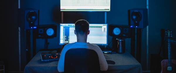 Audio technician working in a sound editing studio, part of Coldea Productions' nationwide live webcasting and streaming services