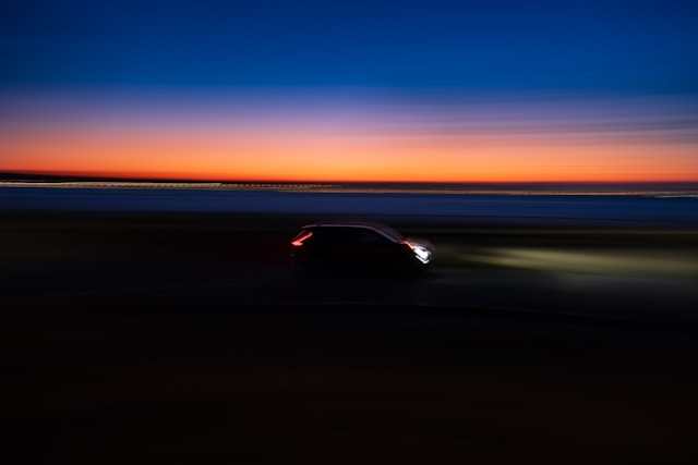 Luxury Aston Martin driving at sunset along the California coast – Coldea Productions automotive video campaign.