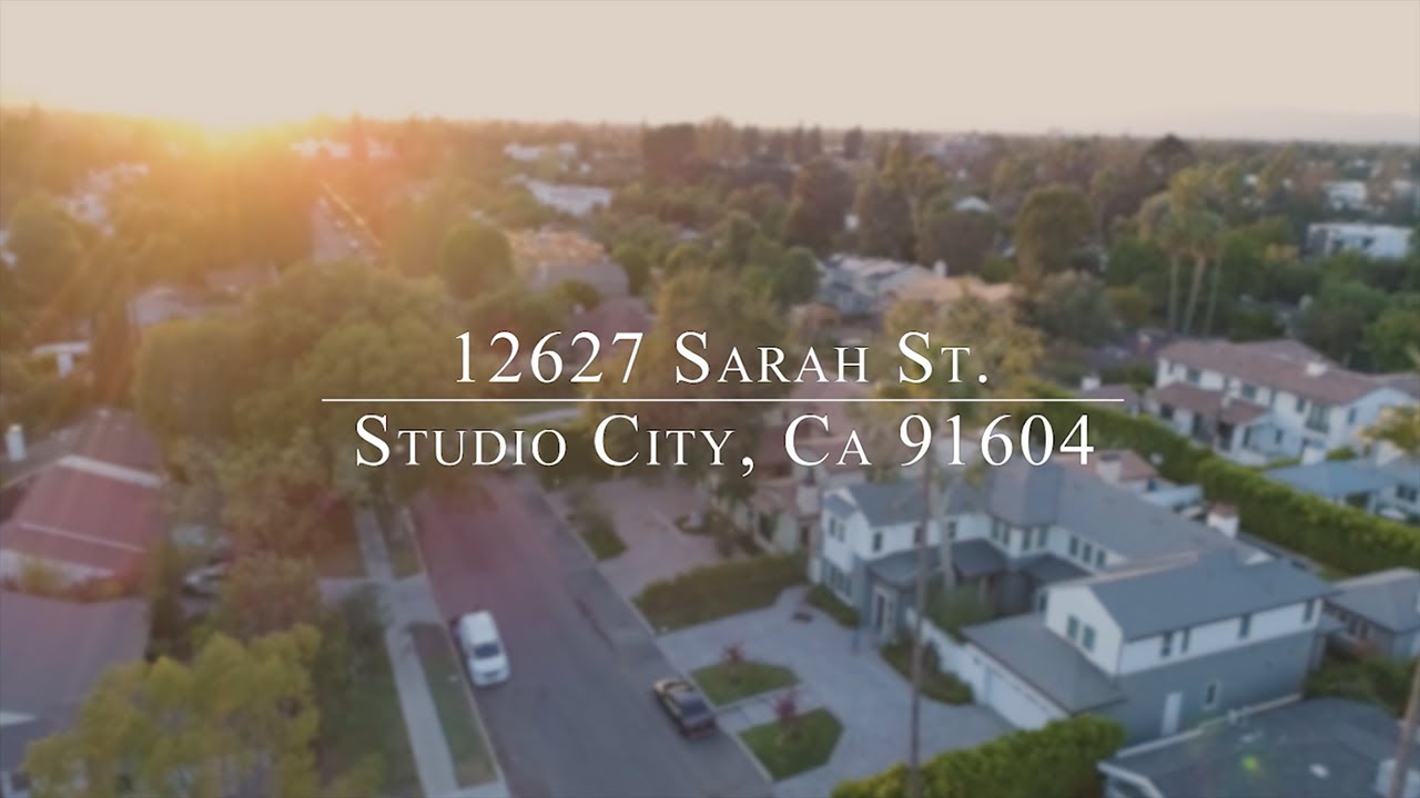 Aerial view of a residential neighborhood at sunset, with text displaying the address "12627 Sarah St, Studio City, CA 91604," captured in a real estate video.
