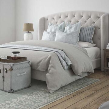 Elegant, modern bedroom with neutral tones, captured for real estate photography by Coldea Productions.