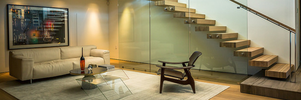 Modern interior of a Hollywood Hills home with floating staircase and stylish living area, captured by Coldea Productions for a real estate video.