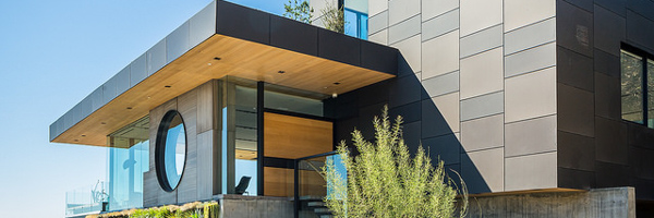 Modern architectural home exterior with unique design features, captured by Coldea Productions to showcase real estate video production services