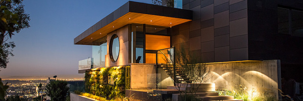 Modern luxury home with ambient lighting in the Hollywood Hills, captured at dusk by Coldea Productions.