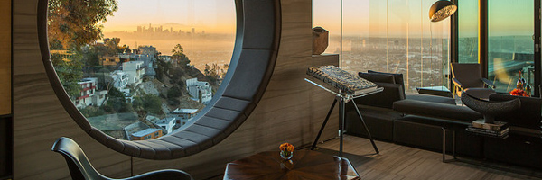 Stunning interior view of a modern home overlooking a cityscape at sunset, highlighting Coldea Productions' real estate video production services in Chandler, Arizona.