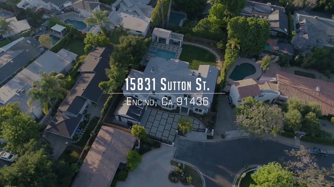 Aerial view of a luxury property located at 15831 Sutton St., Encino, CA 91436, captured for real estate video purposes.