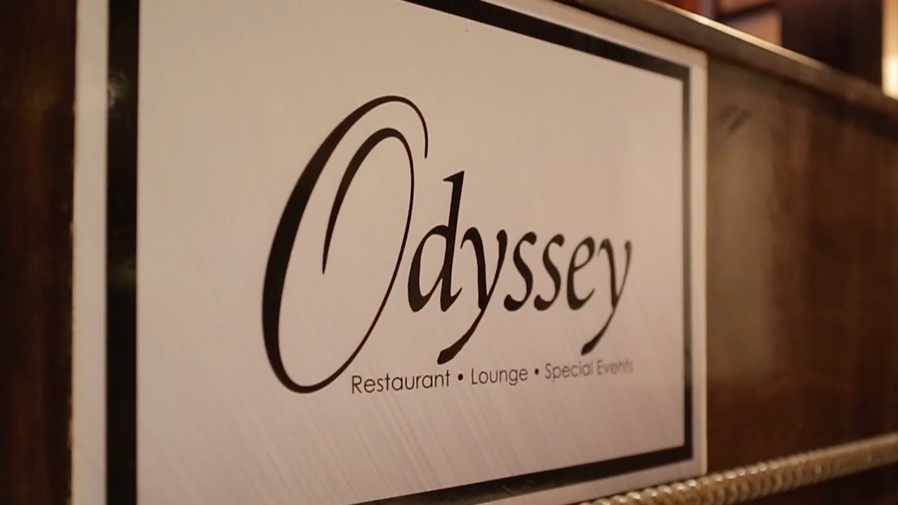 This image displays an array of vibrant gym straps hanging in a professional fitness setup, highlighting STRAPS company's products. Captured as part of a product video presentation by Coldea Productions, this visual emphasizes durability and functionality, ideal for promoting fitness equipment in gyms and training centers.