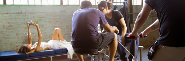 Coldea Productions team filming a model for a commercial video on set in City of Industry, California, using professional lighting and camera equipment.