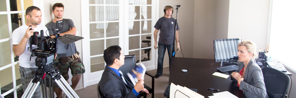 Professional video crew from Coldea Productions filming an office scene, demonstrating video production services in Chandler, Arizona.