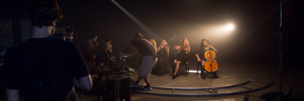 Coldea Productions crew filming a live orchestra performance for a commercial video in a studio setting in Carlsbad, California.