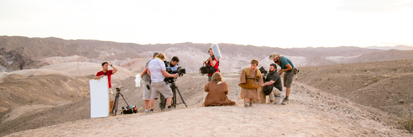 Film crew setting up a shoot in a desert landscape, representing Coldea Productions' video production services in Phoenix, Arizona.