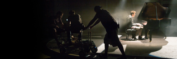 Coldea Productions filming a pianist on a grand piano during a commercial video shoot in Culver City, California, with a professional camera crew on set.