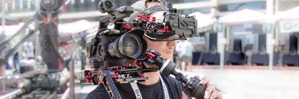 Professional videographer from Coldea Productions shooting a commercial video on location in Escondido, California, using high-end camera equipment.