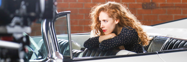 Actress in classic convertible during a Coldea Productions video commercial shoot in Irvine, California.
