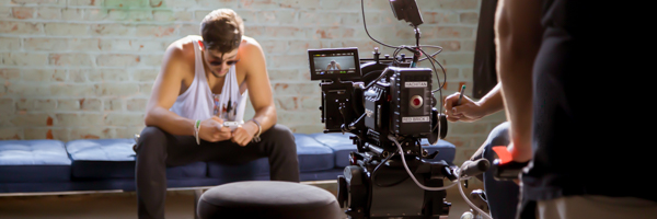 Coldea Productions filming a commercial scene with a young man on set in Corona, California, using professional video equipment.