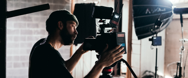Professional videographer operating a camera on a film set, ideal for video production services in Phoenix, AZ, by Coldea Productions.