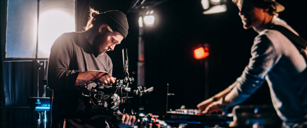 Professional camera capturing a corporate team event, ideal for corporate video production services by Coldea Productions.