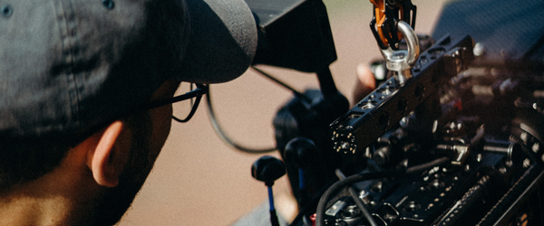 Close-up of a videographer operating a professional camera rig, ideal for video production services for production companies in Arizona, by Coldea Productions.